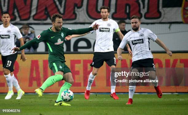 Frankfurt's Marc Stendera in action against Bremen's Philipp Bargfrede during the German Bundesliga soccer match between Eintracht Frankfurt and...