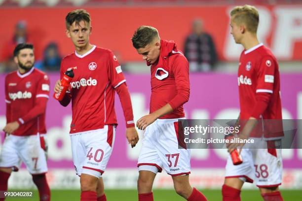 Kaiserslautern's Brandon Borrello , Torben Muesel, Nicklas Shipnoski and Nils Seufert leave the playing field after the German 2nd division...