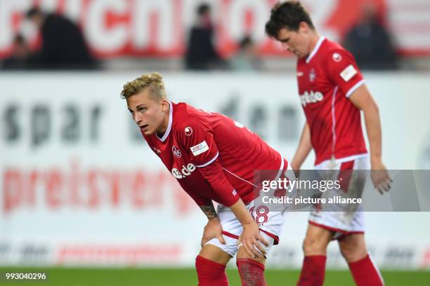 Kaiserslautern's Nils Seufert and Patrick Ziegler standing on the playing field after the German 2nd division Bundesliga soccer match between 1. FC...