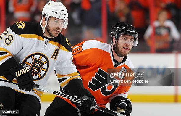 Mike Richards of the Philadelphia Flyers skates against Mark Recchi of the Boston Bruins in Game Six of the Eastern Conference Semifinals during the...