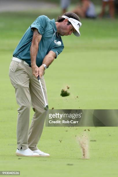 Bubba Watson hits his second shot into the 10th hole during round two of A Military Tribute At The Greenbrier held at the Old White TPC course on...