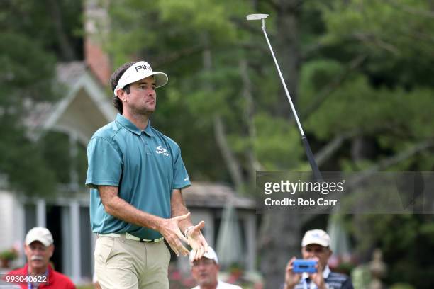 Bubba Watson tosses his putter in the air after missing a birdie putt on the 10th hole during round two of A Military Tribute At The Greenbrier held...