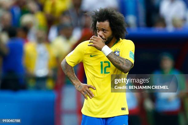 Brazil's defender Marcelo reacts to his team's defeat at the end of the Russia 2018 World Cup quarter-final football match between Brazil and Belgium...