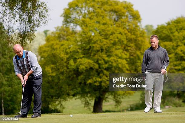 Ray Kruger of North Middlesex makes putt on the 17th hole during the Virgin Atlantic PGA National Pro-Am Championship Regional Qualifier at Old Ford...