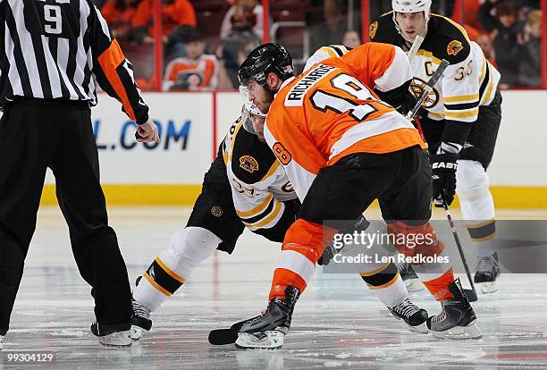 Mike Richards of the Philadelphia Flyers readies to face-off against Patrice Bergeron of the Boston Bruins in Game Six of the Eastern Conference...