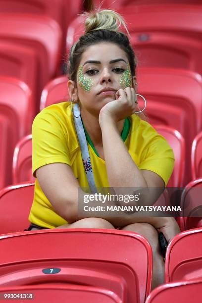 Brazil fan reacts to their loss during the Russia 2018 World Cup quarter-final football match between Brazil and Belgium at the Kazan Arena in Kazan...