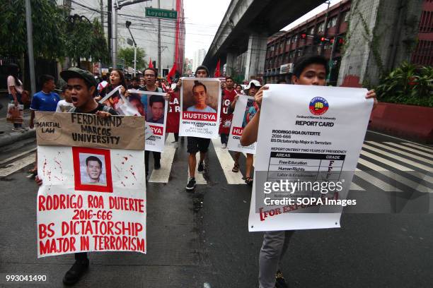 Students holding posters as they march towards Mendiola Bridge. Youth groups protest against the alleged human rights violation of the current...