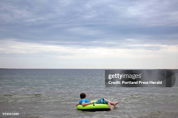 Josh Saunders of Raymond braves the bracing water on Thursday at Crescent Beach State Park.