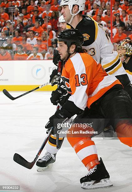 Dan Carcillo of the Philadelphia Flyers skates against Zdeno Chara of the Boston Bruins in Game Six of the Eastern Conference Semifinals during the...