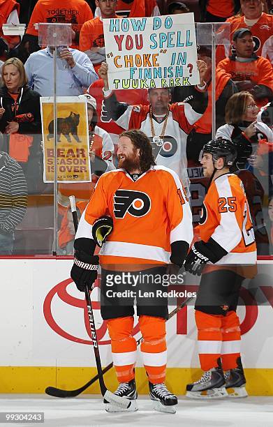 Scott Hartnell and Matt Carle of the Philadelphia Flyers have some passionate fans show support for their team during the pregame warm-ups against...