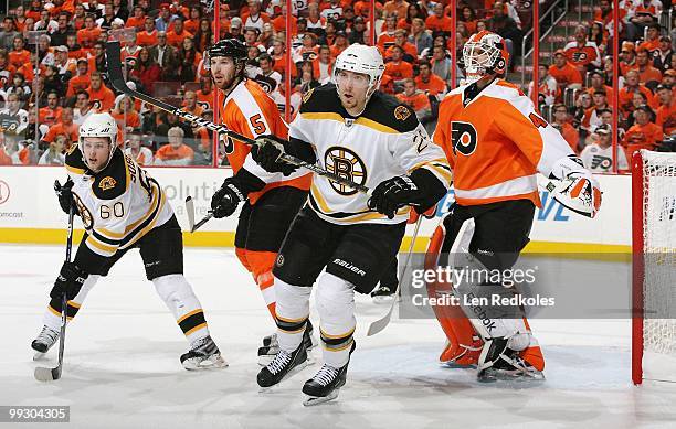 Braydon Coburn and Michael Leighton of the Philadelphia Flyers do battle with Vladimir Sobotka and Blake Wheeler of the Boston Bruins in Game Six of...