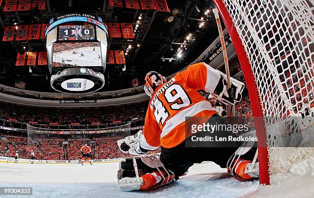 Michael Leighton of the Philadelphia Flyers makes a glove save from a shot on goal by a member of the Boston Bruins in Game Six of the Eastern...
