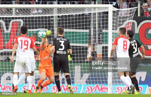 Augsburg's Kevin Danso scores the 1-1 goal during the German Bundesliga soccer match between FC Augsburg and Bayer Leverkusen in Augsburg, Germany,...