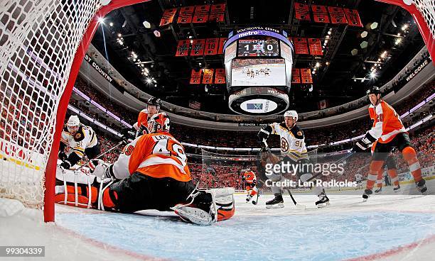 Michael Leighton, Matt Carle, Ville Leino and Chris Pronger of the Philadelphia Flyers all stop a scoring attempt by Miroslav Satan and Marc Savard...