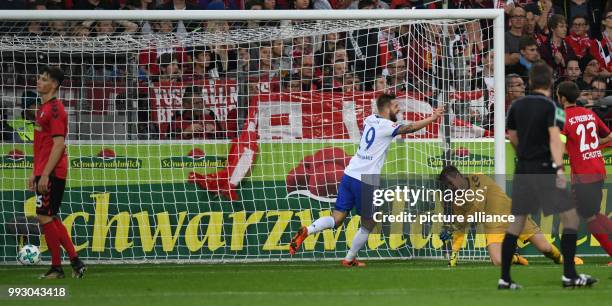 Freiburg's Pascal Stenzel and goalkeeper Alexander Schwolow look disappointed after the 0-1 goal by Schalke during the German Bundesliga soccer match...