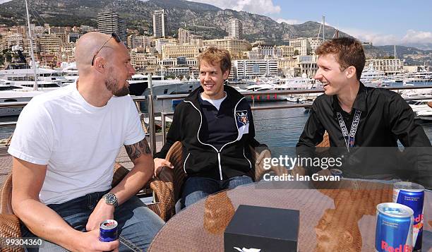 Marco Buchel, Redbull Formula 1 driver Sebastian Vettel and Swiss Ski-Jumper Simon Ammann attend the Redbull Formula 1 Energy Station on May 14, 2010...