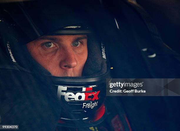 Denny Hamlin, driver of the FedEx Freight Toyota, sits in his car prior to practice for the NASCAR Sprint Cup Series Autism Speaks 400 at Dover...