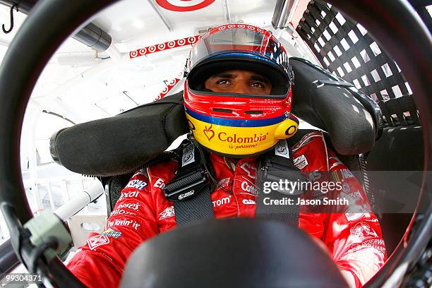 Juan Pablo Montoya, driver of the Target Chevrolet, sits in his car in the garage area during practice for the NASCAR Sprint Cup Series Autism Speaks...