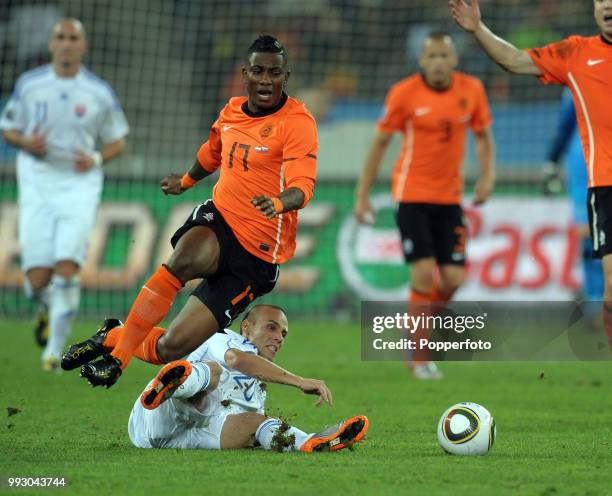 Eljero Elia of the Netherlands is tackled by Kamil Kopunek of Slovakia during a FIFA World Cup Round of 16 match at the Moses Mabhida Stadium on June...