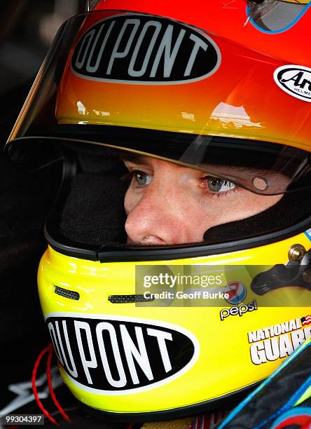 Jeff Gordon, driver of the DuPont Chevrolet, sits in his car during practice for the NASCAR Sprint Cup Series Autism Speaks 400 at Dover...