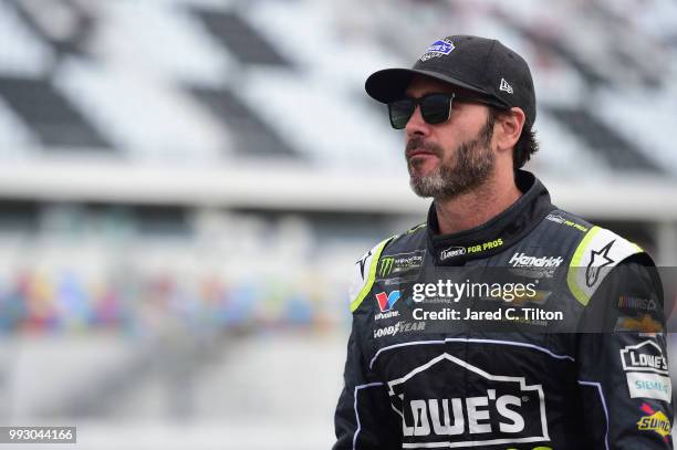 Jimmie Johnson, driver of the Lowe's for Pros Chevrolet, stands by his car during qualifying for the Monster Energy NASCAR Cup Series Coke Zero Sugar...