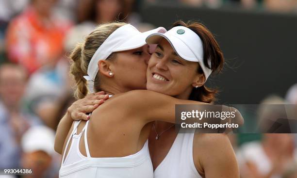 Anna Kournikova of Russia kisses her partner Martina Hingis after victory in the Womens Doubles on day eight of the 2010 Wimbledon Championships at...