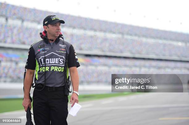 Chad Knaus, crew chief for Jimmie Johnson, driver of the Lowe's for Pros Chevrolet, walks down pit road during qualifying for the Monster Energy...