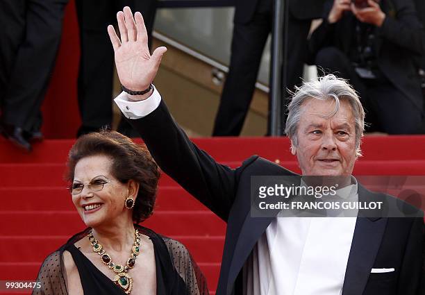 Italian actress Claudia Cardinale and French actor Alain Delon arrive for the screening of "Il Gattopardpo" presented during a special screening at...