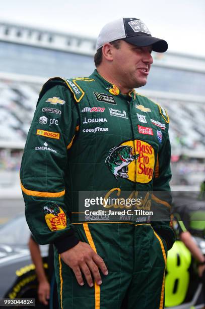 Ryan Newman, driver of the Bass Pro Shops/Cabela's Chevrolet, stands on the grid during qualifying for the Monster Energy NASCAR Cup Series Coke Zero...
