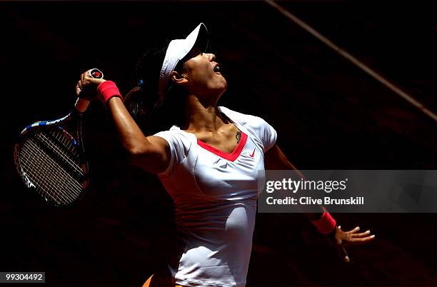 Na Li of China serves against Shahar Peer of Israel in their quarter final match during the Mutua Madrilena Madrid Open tennis tournament at the Caja...