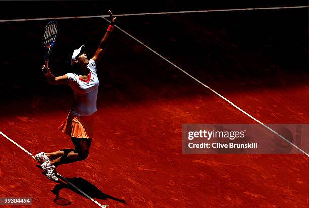 Na Li of China serves against Shahar Peer of Israel in their quarter final match during the Mutua Madrilena Madrid Open tennis tournament at the Caja...