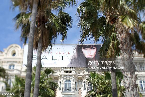 Poster promoting the movie "Salt" staring US actress Angelina Jolie is displayed on the Carlton Hotel during the 63rd Cannes Film Festival on May 14,...