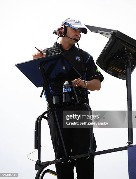 Chad Knaus, crew chief of the Lowe's Chevrolet, stands on top of the team hauler in the garage area during practice for the NASCAR Sprint Cup Series...