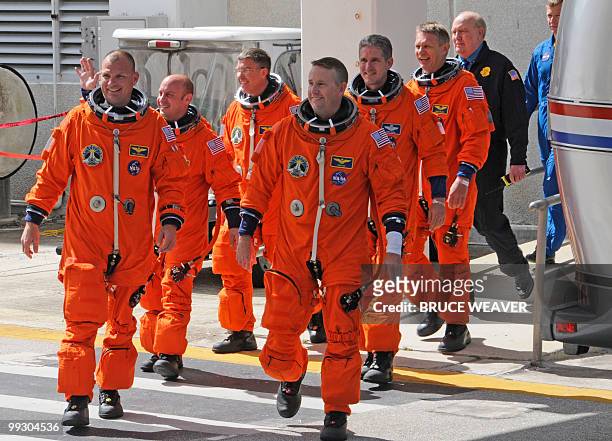The US space shuttle Atlantis crew Pilot Tony Antonelli, Garret Reisman, Steve Bowen, Commander Ken Ham, Michael Good, and Piers Sellers are seen on...