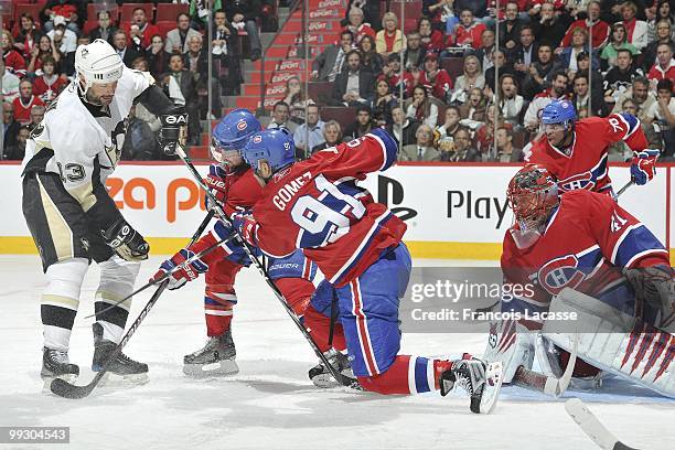 Bill Guerin of the Pittsburgh Penguins takes a shot on goalie Jaroslav Halak of Montreal Canadiens in Game Six of the Eastern Conference Semifinals...