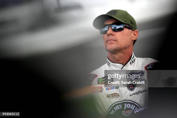 Kevin Harvick, driver of the Jimmy John's Kickin' Ranch Ford, stands by his car during qualifying for the Monster Energy NASCAR Cup Series Coke Zero...