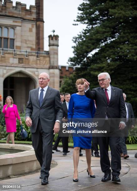 Federal President Frank-Walter Steinmeier and his wife Elke Buedenbender walk with the governor of New South Wales, David John Hurley, in front of...