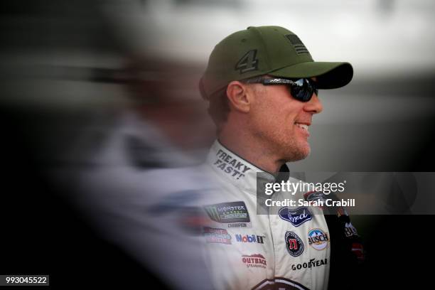 Kevin Harvick, driver of the Jimmy John's Kickin' Ranch Ford, stands by his car during qualifying for the Monster Energy NASCAR Cup Series Coke Zero...