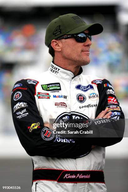 Kevin Harvick, driver of the Jimmy John's Kickin' Ranch Ford, stands by his car during qualifying for the Monster Energy NASCAR Cup Series Coke Zero...