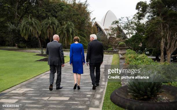 Federal President Frank-Walter Steinmeier and his wife Elke Buedenbender walk with the governor of New South Wales, David John Hurley, in front of...