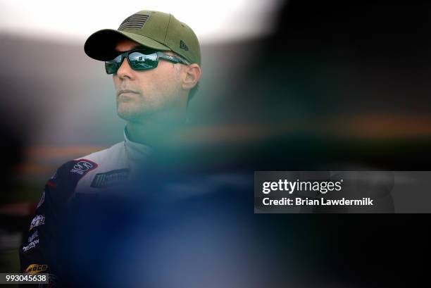 Kevin Harvick, driver of the Jimmy John's Kickin' Ranch Ford, stands by his car during qualifying for the Monster Energy NASCAR Cup Series Coke Zero...