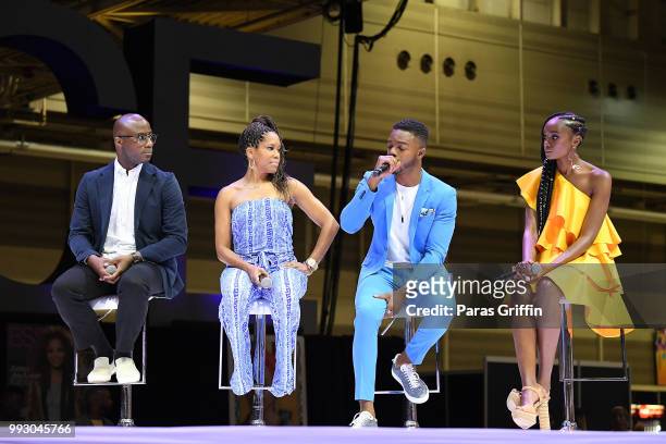 Barry Jenkins, Regina King, Stephan James and Kiki Layne speak onstage during the 2018 Essence Festival presented by Coca-Cola at Ernest N. Morial...