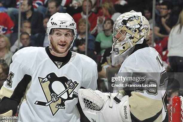 Matt Cooke of the Pittsburgh Penguins talks with teammate goalie Marc-Andre Fleury in Game Six of the Eastern Conference Semifinals against the...