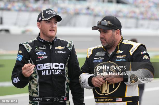 Ty Dillon, driver of the GEICO Military Chevrolet, talks with Brendan Gaughan, driver of the Beard Oil Distributing/South Point Hotel & Casino,...