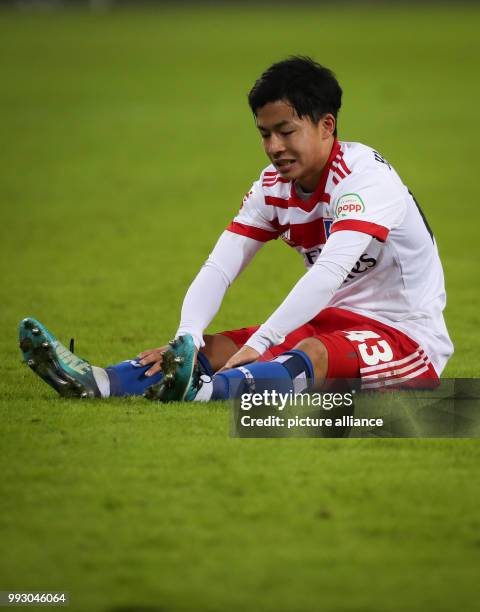 Hamburg's Tatsuya Ito sitting down on the field during the German Bundesliga soccer match between Hamburger SV and VfB Stuttgart in the Volkspark...