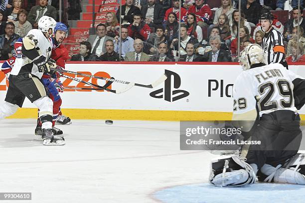 Tomas Plekanec of Montreal Canadiens takes a shot in front of Marc-Andre Fleury of the Pittsburgh Penguins in Game Six of the Eastern Conference...