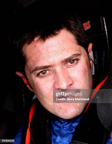 David Stremme, driver of the Air Gaurd Ford, waits in his car during practice for the NASCAR Sprint Cup Series Autism Speaks 400 at Dover...