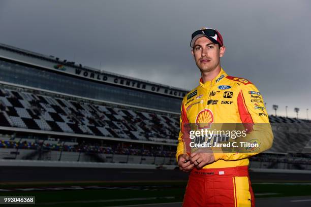 Joey Logano, driver of the Shell Pennzoil Ford, walks on the grid during qualifying for the Monster Energy NASCAR Cup Series Coke Zero Sugar 400 at...