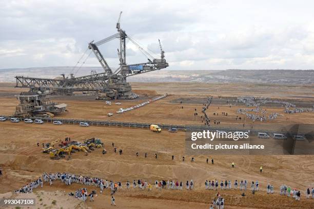 Participants of the coalition for action protest "Ende Gelaende" enter the strip mine Hambach in Kerpen, Germany, 05 November 2017. One day before...