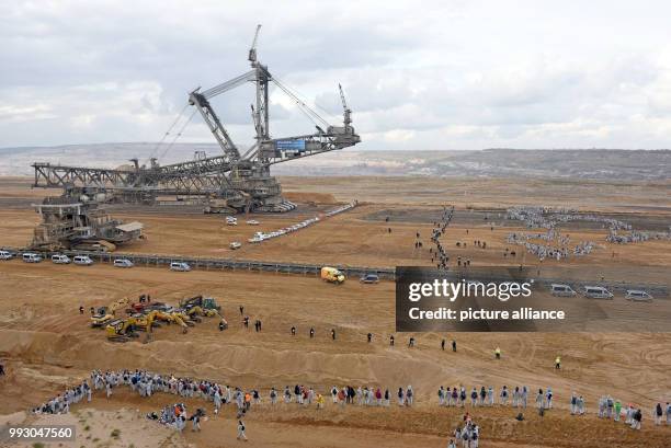 Activists of the 'Ende Gelaende' group gather to blockade coal operations at the strip mine of Hambach in Kerpen, Germany, 05 November 2017. A day...